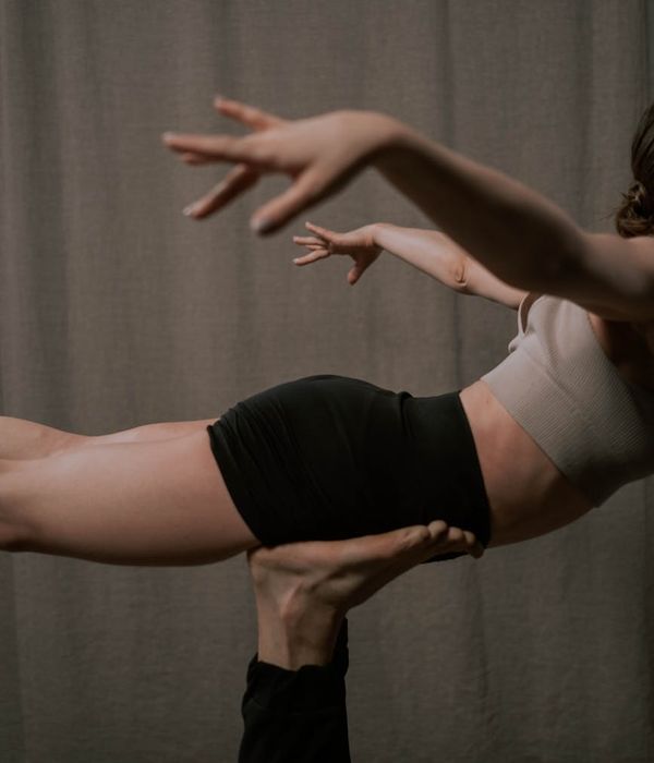 Older adult performing a gentle and safe yoga stretch.